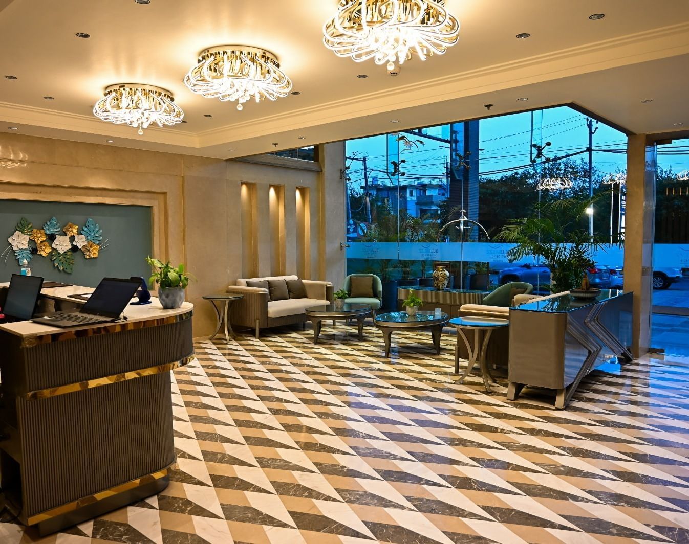 A spacious lobby featuring comfortable seating arrangements and a reception desk at 